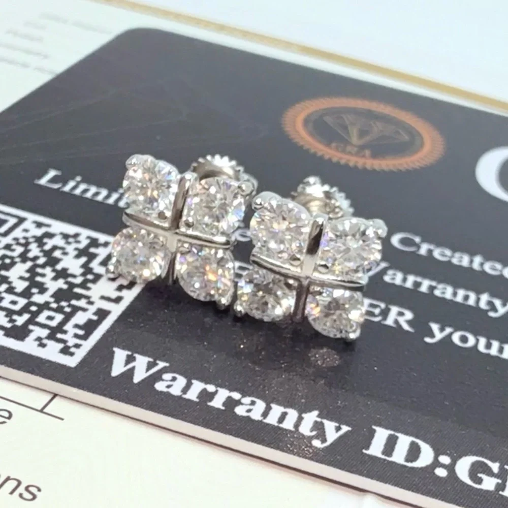 1.6ct Moissanite Cross Over Stud Earrings . Platinum plated .